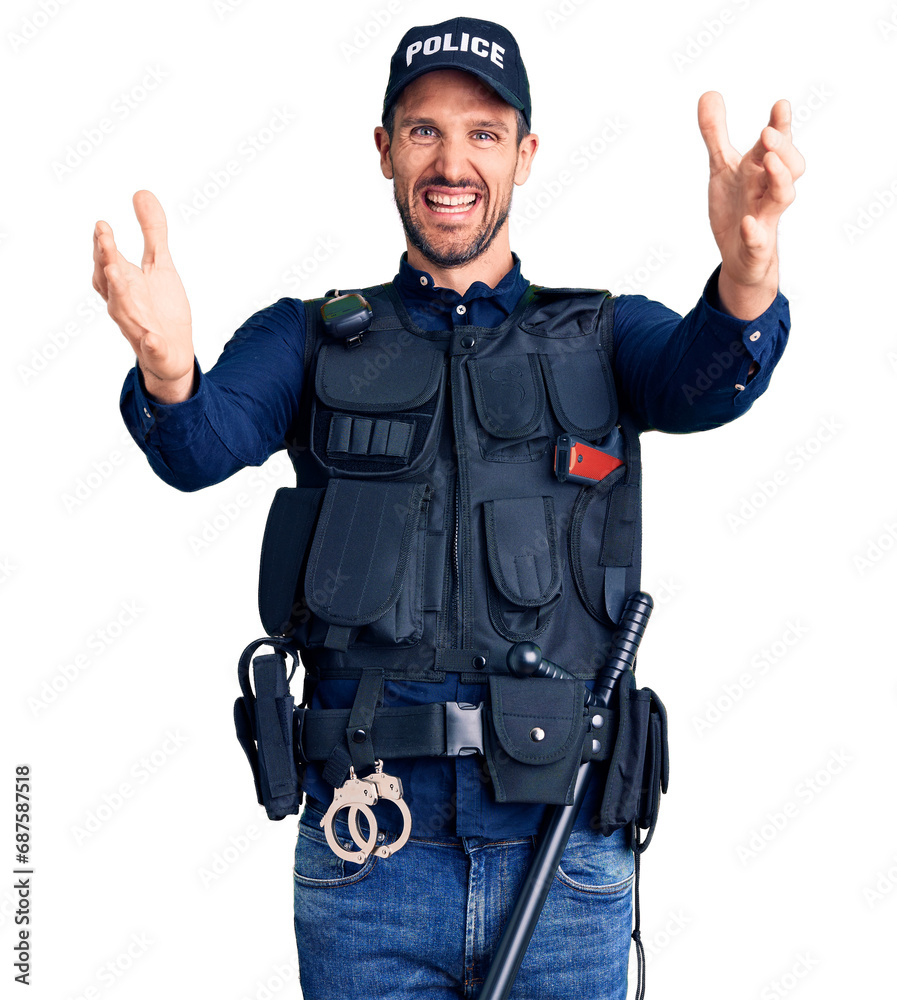 Young handsome man wearing police uniform looking at the camera smiling with open arms for hug. cheerful expression embracing happiness. Young handsome man wearing police uniform looking at the camera smiling with open arms for hug. cheerful expression embracing happiness.