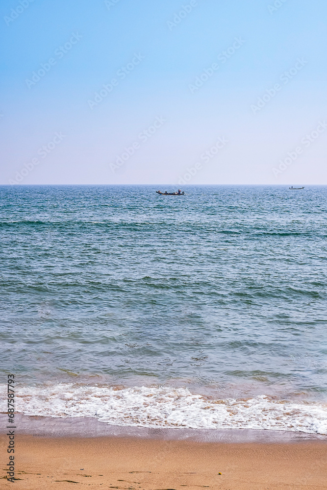 Scene of beach life on a Sunny day at renowned  Indian seashore of Puri, Odisha, India,Asia. 12.02.2020.