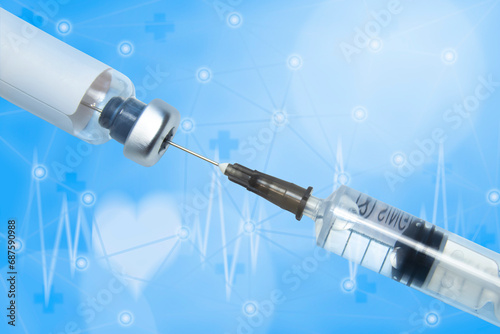 Syringe with injection on a blue medical background. Healthcare and medicine concept