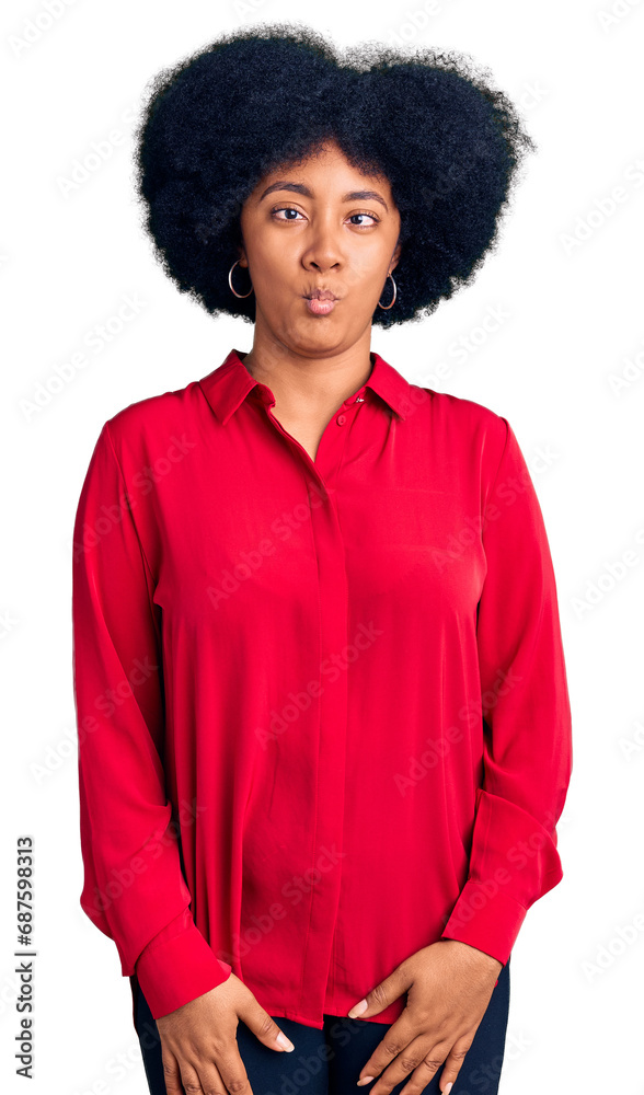 Young african american girl wearing casual clothes making fish face with lips, crazy and comical gesture. funny expression. Young african american girl wearing casual clothes making fish face with lips, crazy and comical gesture. funny expression.