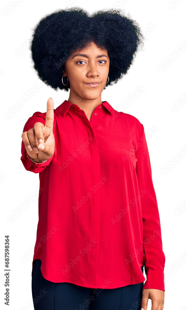 Young african american girl wearing casual clothes pointing with finger up and angry expression, showing no gesture