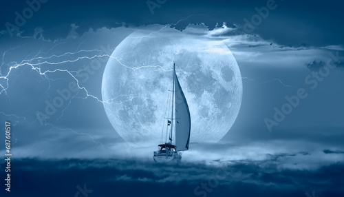 Sailing yacht in a stormy weather with thunder and lightning Super Full Moon in the background "Elements of this image furnished by NASA "