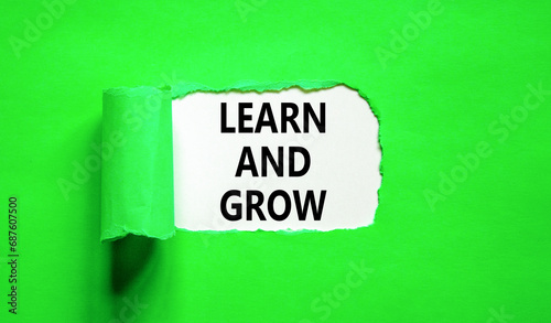Learn and grow symbol. Concept word Learn And Grow on beautiful white paper. Beautiful green table green background. Business, education learn and grow concept. Copy space.