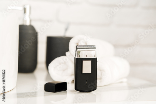 Electric shaver for men in a bathroom close up