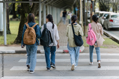 Group of Young Asian student walking and talking at university before class room. education, back to school concept