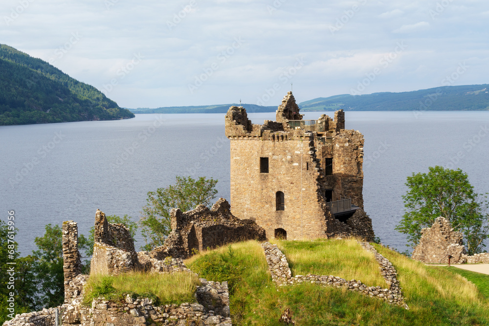 Urquhart Castle ruins with tower and walls in front of Loch Ness