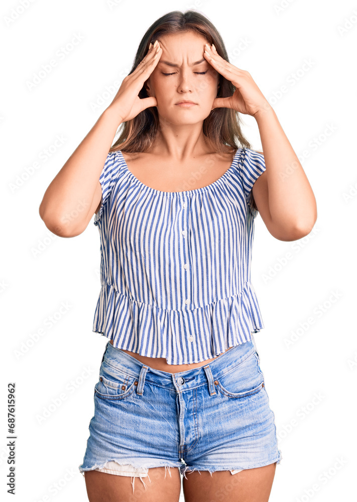 Beautiful caucasian woman wearing casual clothes suffering from headache desperate and stressed because pain and migraine. hands on head. Beautiful caucasian woman wearing casual clothes suffering from headache desperate and stressed because pain and migraine. hands on head.
