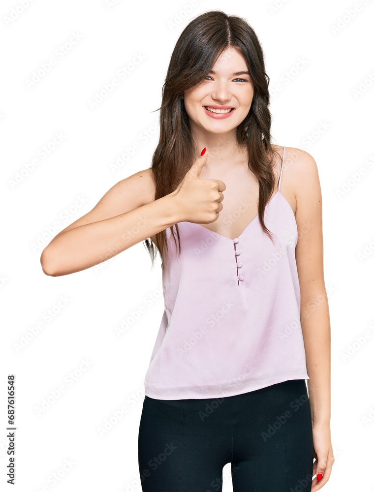 Fototapeta premium Young beautiful caucasian girl wearing casual clothes doing happy thumbs up gesture with hand. approving expression looking at the camera showing success.