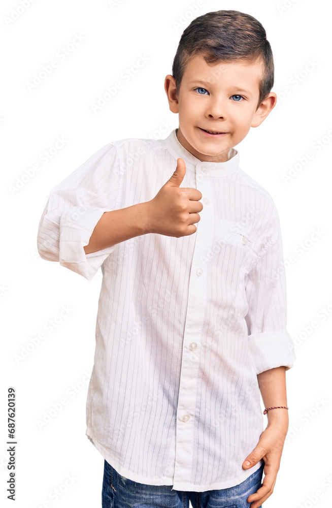 Cute blond kid wearing elegant shirt doing happy thumbs up gesture with hand. approving expression looking at the camera showing success. Cute blond kid wearing elegant shirt doing happy thumbs up gesture with hand. approving expression looking at the camera showing success.