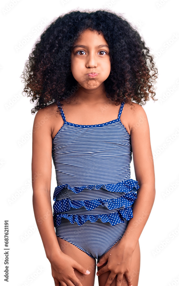 African american child with curly hair wearing swimwear puffing cheeks with funny face. mouth inflated with air, crazy expression. - obrazy, fototapety, plakaty 
