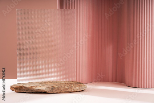 Podium for exhibitions and product presentations, material: stone, wood, glass, dry branches. Beautiful beige background made from natural materials. Abstract nature scene with composition.