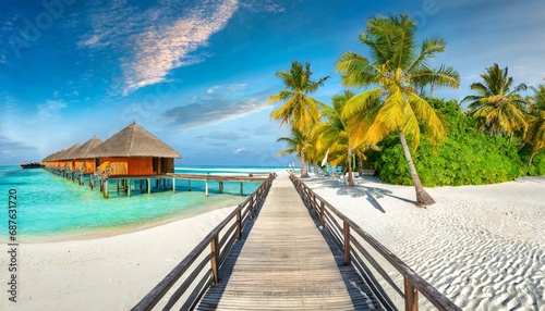 maldives island beach panorama palm trees and beach bar and long wooden pier pathway tropical vacation and summer holiday background concept
