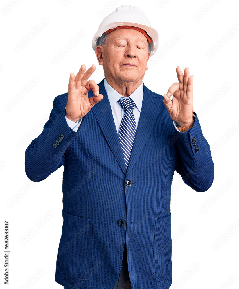 Senior handsome grey-haired man wearing suit and architect hardhat relax and smiling with eyes closed doing meditation gesture with fingers. yoga concept.