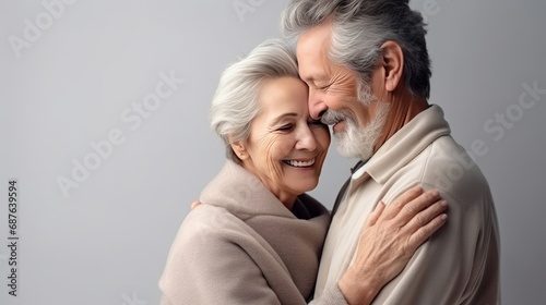 Old senior couple in love hug and embrace with romance together close-up portrait background. Hug Day, St Valentines concept. Happy mature man and woman hugging together. Elderly people in love..