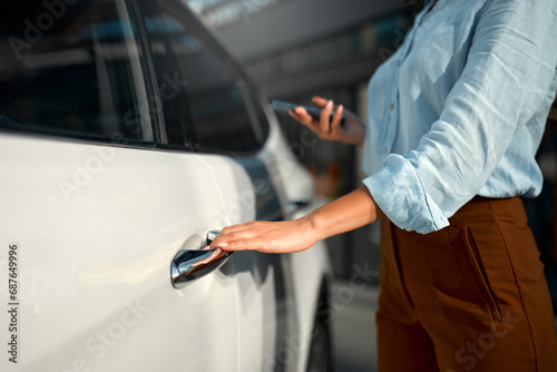 Woman near car on the street