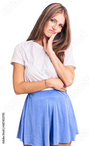 Young beautiful blonde woman wearing summer style thinking looking tired and bored with depression problems with crossed arms.