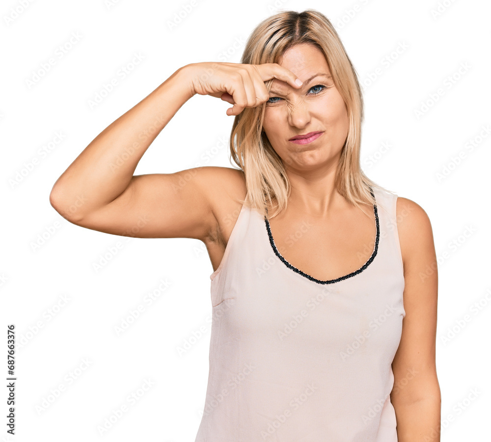 Middle age caucasian woman wearing casual clothes pointing unhappy to pimple on forehead, ugly infection of blackhead. acne and skin problem Middle age caucasian woman wearing casual clothes pointing unhappy to pimple on forehead, ugly infection of blackhead. acne and skin problem