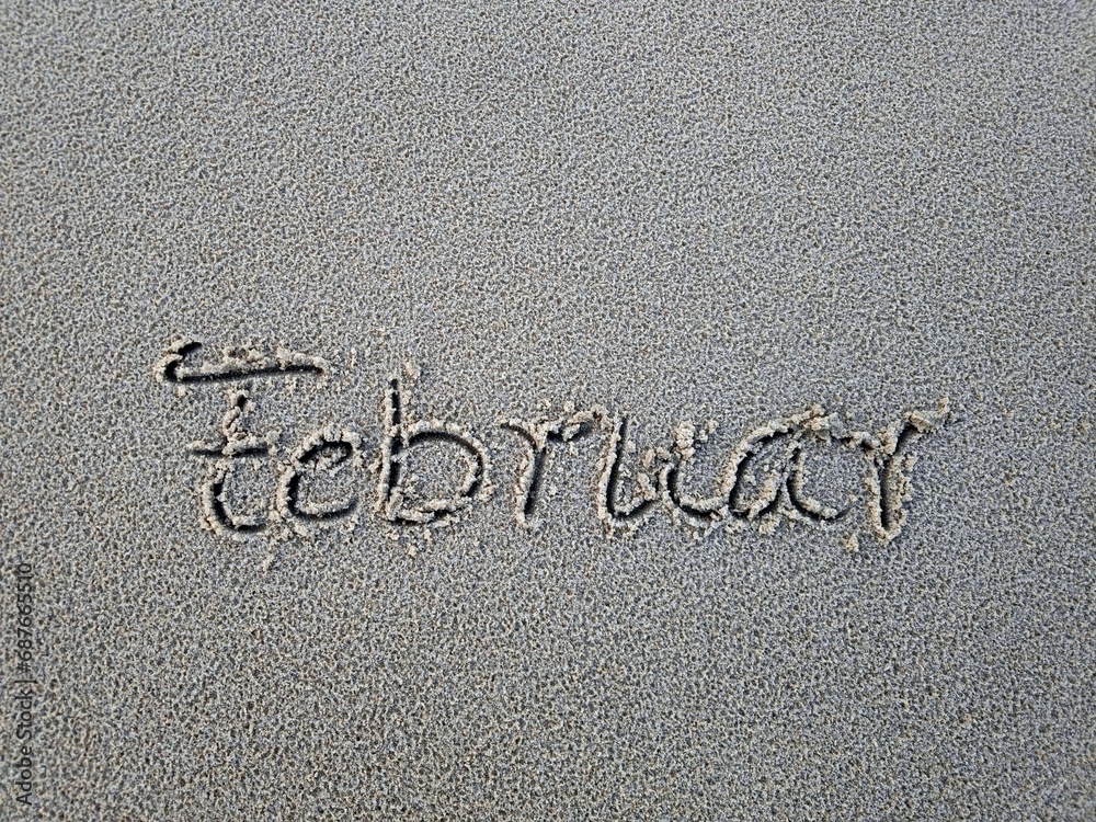 Fototapeta premium Wort Februar im Strandsand