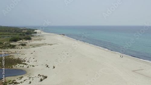 Aerial drone view of Spiaggia di Berchida beach with white sand and turquoise water in Sardinia, Italy photo