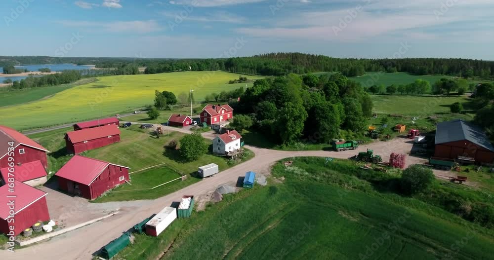 Aerial Forward Shot Of Roofed Houses On Green Landscape On Sunny Day - Mariefred, Sweden Aerial Forward Shot Of Roofed Houses On Green Landscape On Sunny Day - Mariefred, Sweden