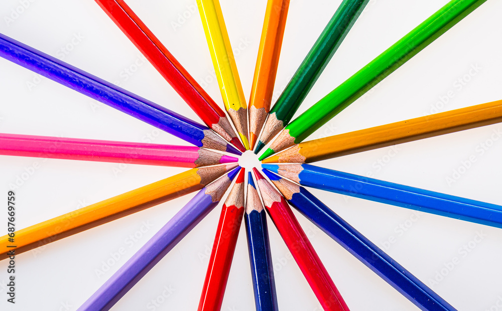 A Circle of Vibrant Colored Pencils Creates a Beautiful and Colorful Arrangement. A group of colored pencils arranged in a circle A Circle of Vibrant Colored Pencils Creates a Beautiful and Colorful Arrangement. A group of colored pencils arranged in a circle