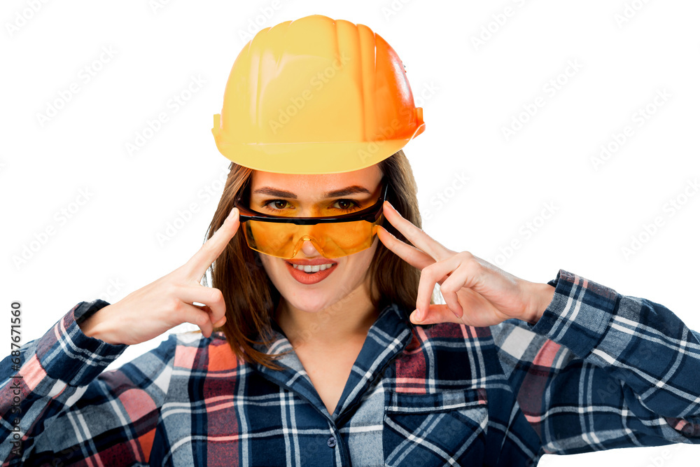 A Woman Wearing a Hard Hat and Glasses. A woman wearing a hard hat and glasses