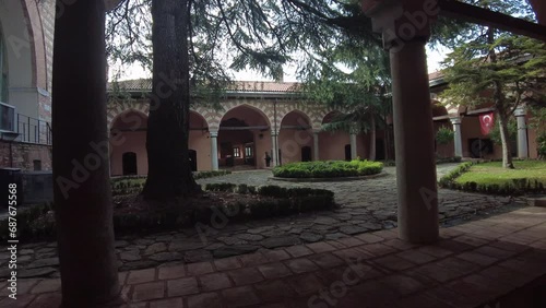 View from the courtyard of the old madrasah with portico. It is a madrasah structure from the Ottoman period. Nowadays it is used as a museum. photo