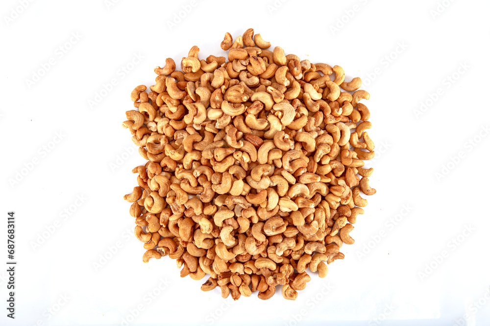 Roasted Cashews. Cashew nuts in copper bowl isolated on white background. background of organic cashew nuts, roasted salted cashew for snack, healthy eating. Roasted Cashews. Cashew nuts in copper bowl isolated on white background. background of organic cashew nuts, roasted salted cashew for snack, healthy eating.