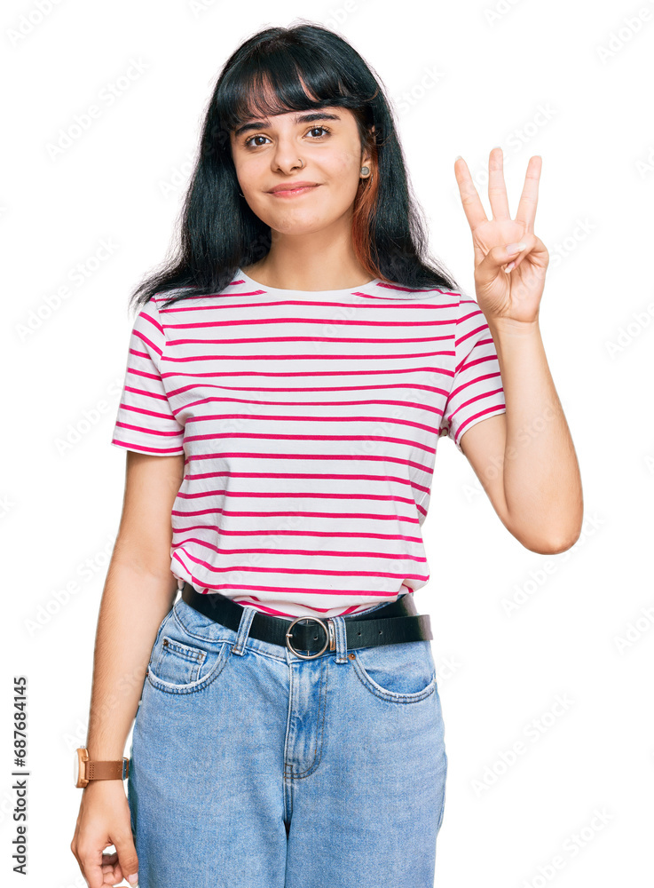 Young hispanic girl wearing casual clothes showing and pointing up with fingers number three while smiling confident and happy. Young hispanic girl wearing casual clothes showing and pointing up with fingers number three while smiling confident and happy.
