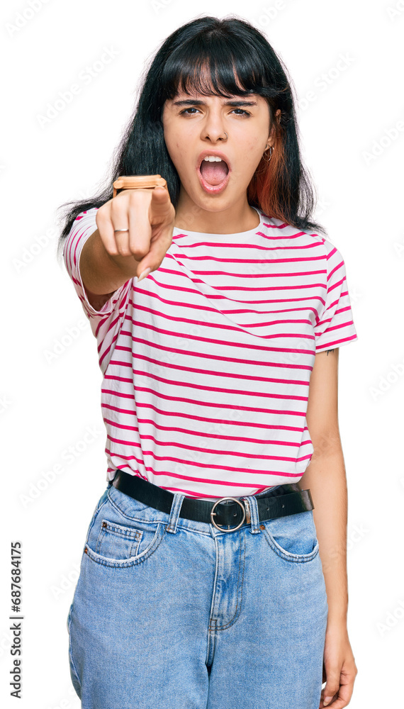 Fototapeta premium Young hispanic girl wearing casual clothes pointing displeased and frustrated to the camera, angry and furious with you