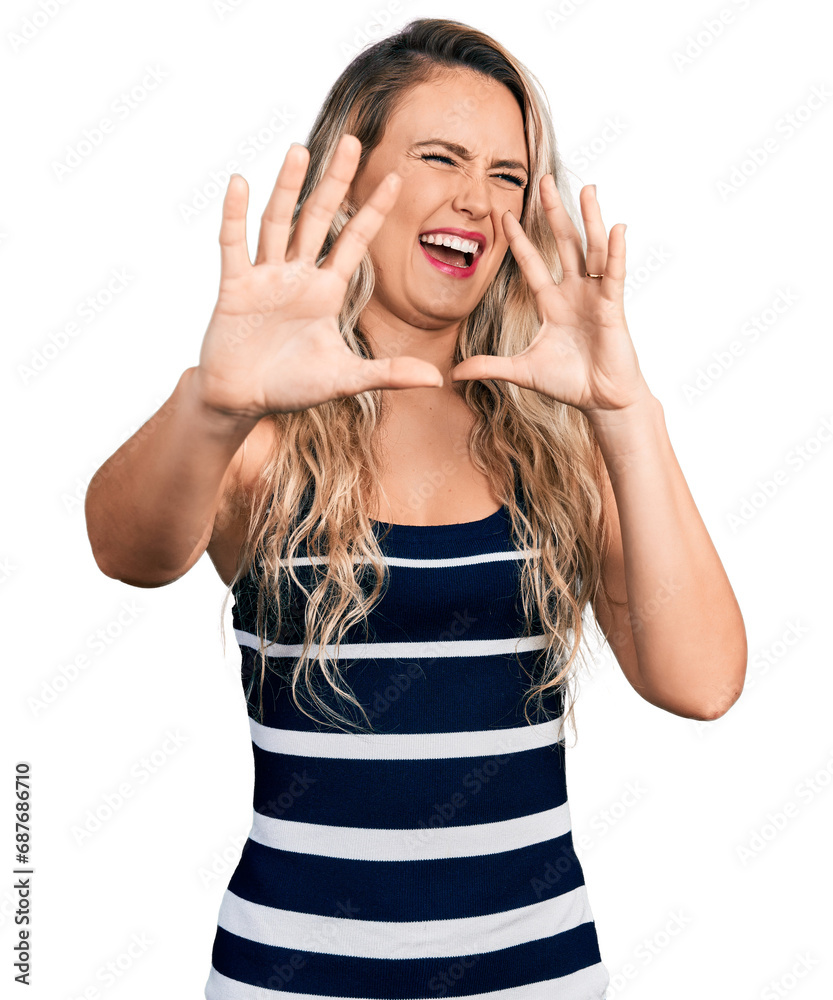 Young blonde woman wearing casual clothes afraid and terrified with fear expression stop gesture with hands, shouting in shock. panic concept.