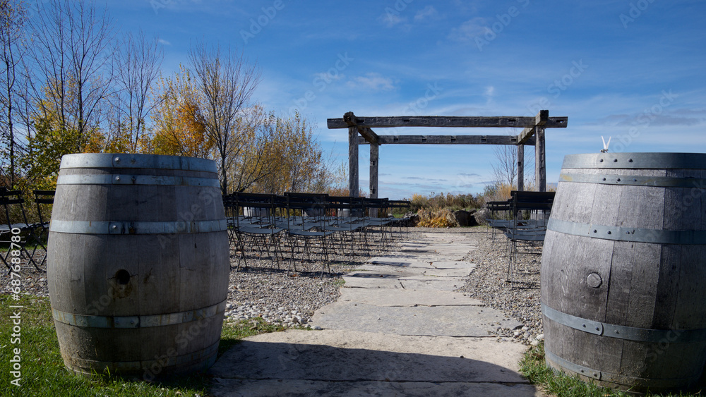 Outdoor wedding venues with wine barrels in the foreground Outdoor wedding venues with wine barrels in the foreground
