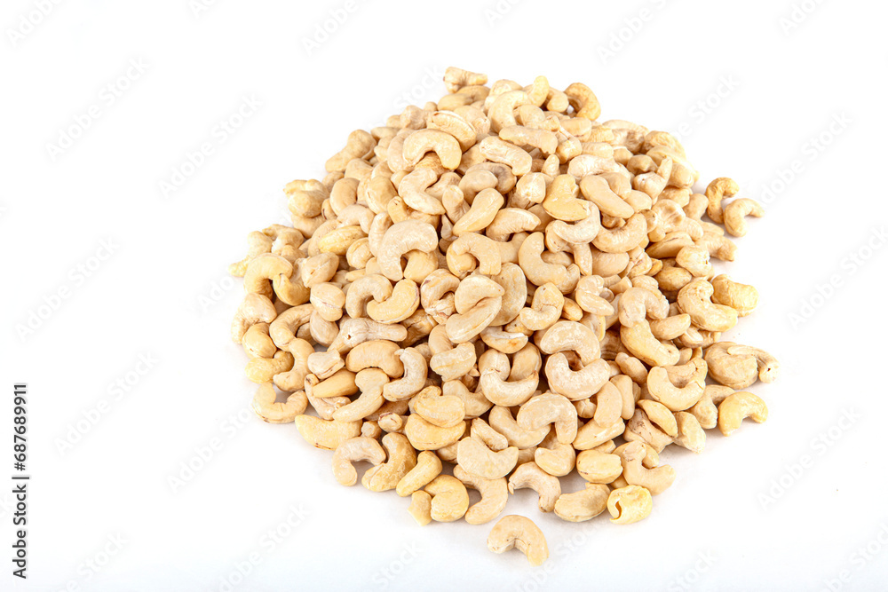 Cashew nuts on white background. Cashew nuts in copper bowl isolated on white background. background of organic cashew nuts, roasted salted cashew for snack, healthy eating.
