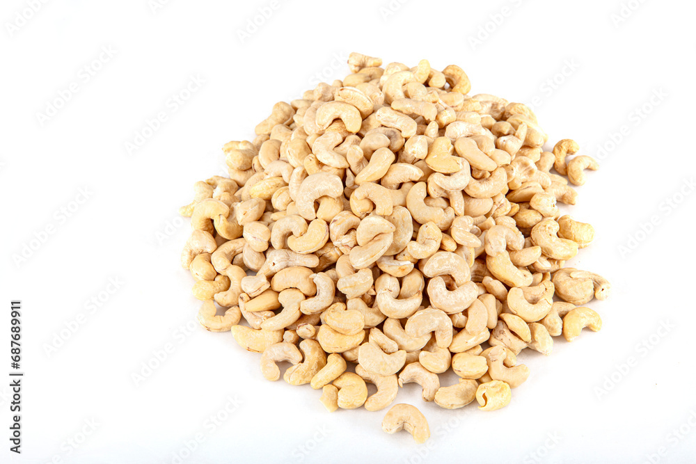 Cashew nuts on white background. Cashew nuts in copper bowl isolated on white background. background of organic cashew nuts, roasted salted cashew for snack, healthy eating. Cashew nuts on white background. Cashew nuts in copper bowl isolated on white background. background of organic cashew nuts, roasted salted cashew for snack, healthy eating.