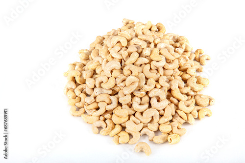 Cashew nuts on white background. Cashew nuts in copper bowl isolated on white background. background of organic cashew nuts, roasted salted cashew for snack, healthy eating.