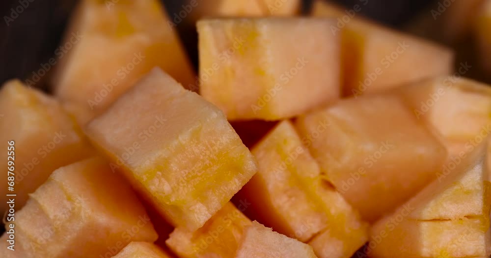 sliced orange melon close-up, delicious soft and ripe food melon on the table sliced orange melon close-up, delicious soft and ripe food melon on the table
