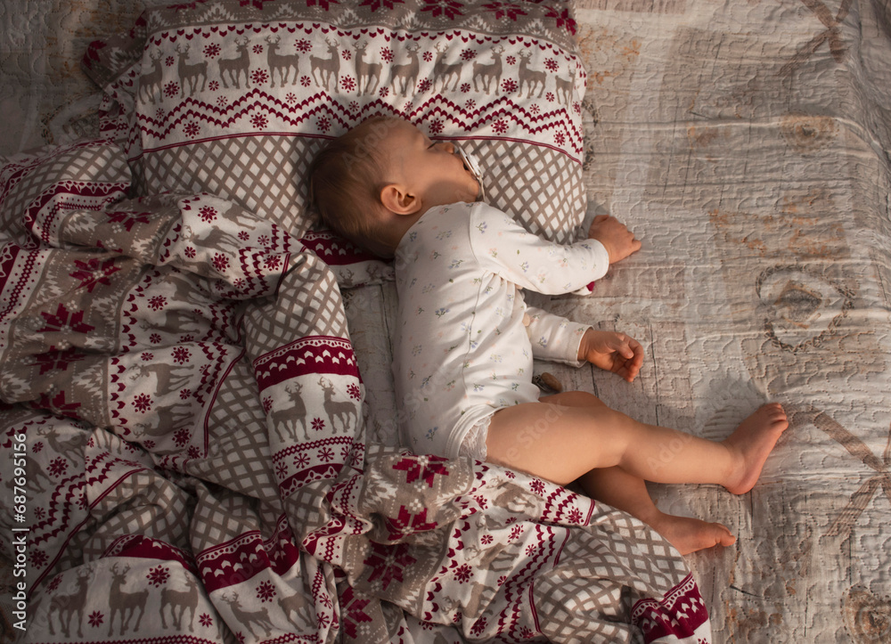 Fototapeta premium baby's sweet nap with pacifier