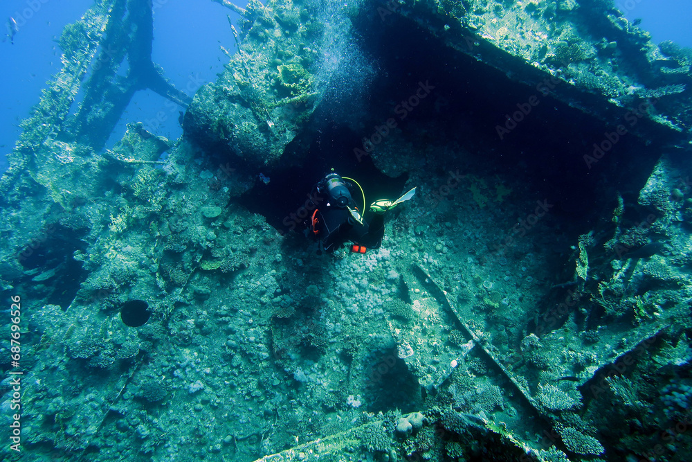 Scuba diver with the wreck of the Giannis D in the Red Sea in Egypt
