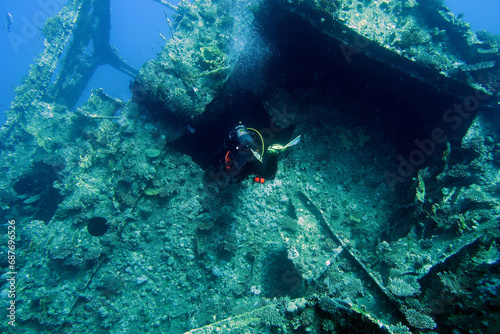 Scuba diver with the wreck of the Giannis D in the Red Sea in Egypt photo