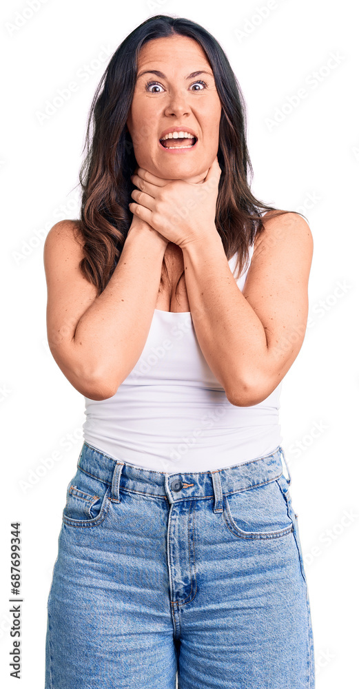 Young beautiful brunette woman wearing casual sleeveless t-shirt shouting and suffocate because painful strangle. health problem. asphyxiate and suicide concept. Young beautiful brunette woman wearing casual sleeveless t-shirt shouting and suffocate because painful strangle. health problem. asphyxiate and suicide concept.