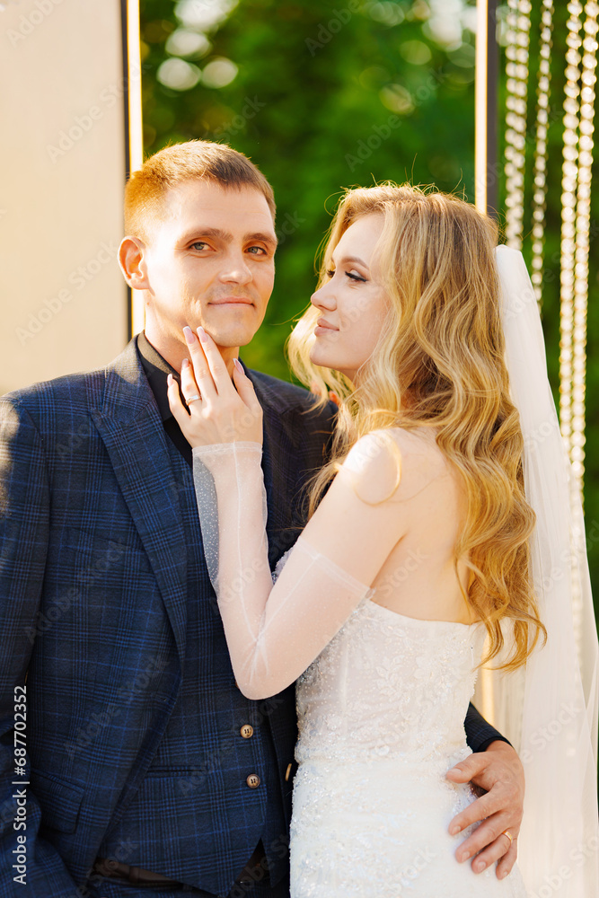 Fototapeta premium The bride and groom at the wedding ceremony venue 