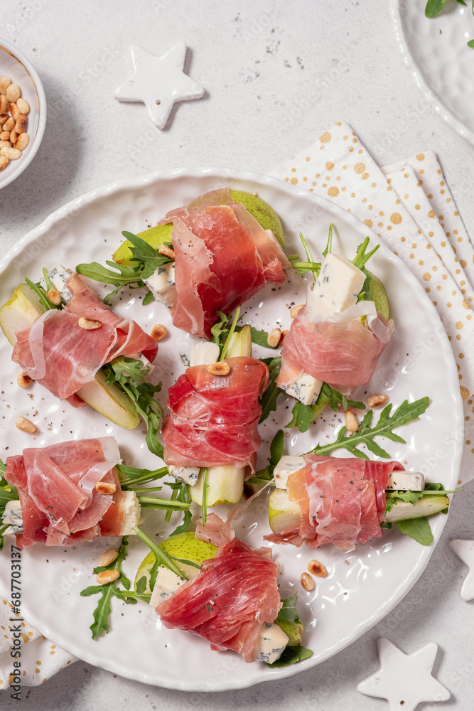 Appetizer with pear, blue cheese and prosciutto ham for holidays Appetizer with pear, blue cheese and prosciutto ham for holidays