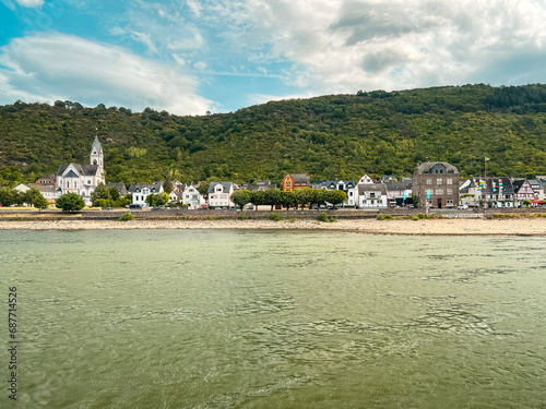 Fototapeta Naklejka Na Ścianę i Meble -  Traveling along the Rhine River with scenic views of the medieval town of Kamp-Bornhofen, Germany. Located within the Rhine Gorge (Middle Rhine) and a UNESCO World Heritage Site.