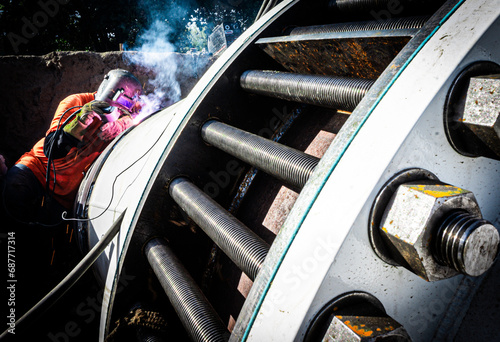 Welder Making Welds to Large Pipe 
