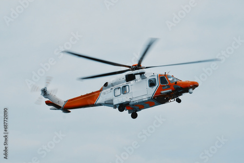 Search And Rescue At Sea. Coast Guard Helicopter On Scene. Assistance For People And Vessels In Distress. Coordination Of Medical Evacuations At Sea. Safety Of Life At Sea.