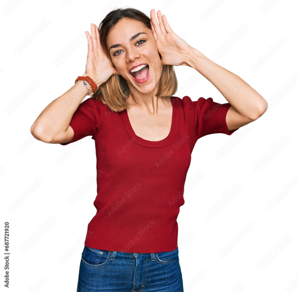 Young blonde girl wearing casual clothes smiling cheerful playing peek a boo with hands showing face. surprised and exited Young blonde girl wearing casual clothes smiling cheerful playing peek a boo with hands showing face. surprised and exited