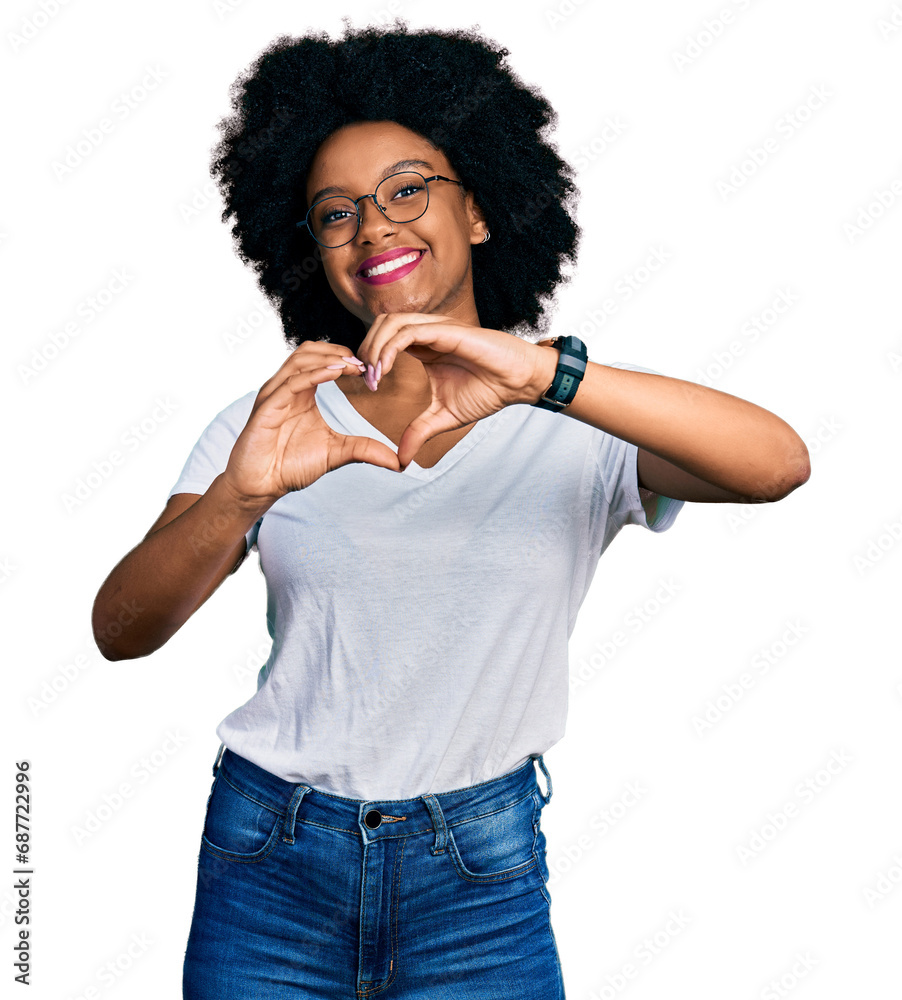Young african american woman wearing casual white t shirt smiling in love doing heart symbol shape with hands. romantic concept. Young african american woman wearing casual white t shirt smiling in love doing heart symbol shape with hands. romantic concept.