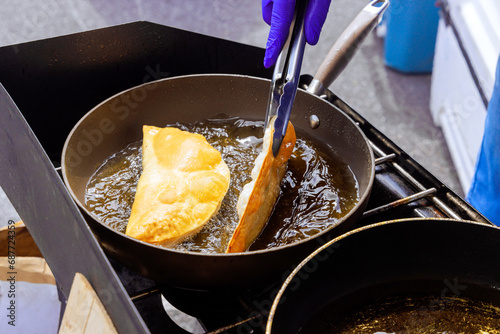 Fried cheburek with oil, traditional Crimean Tatar food dish photo