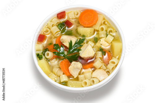 chicken soup with vegetables in a white bowl 