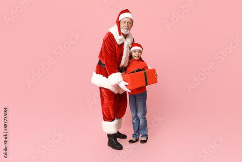 Santa Claus and cute little...